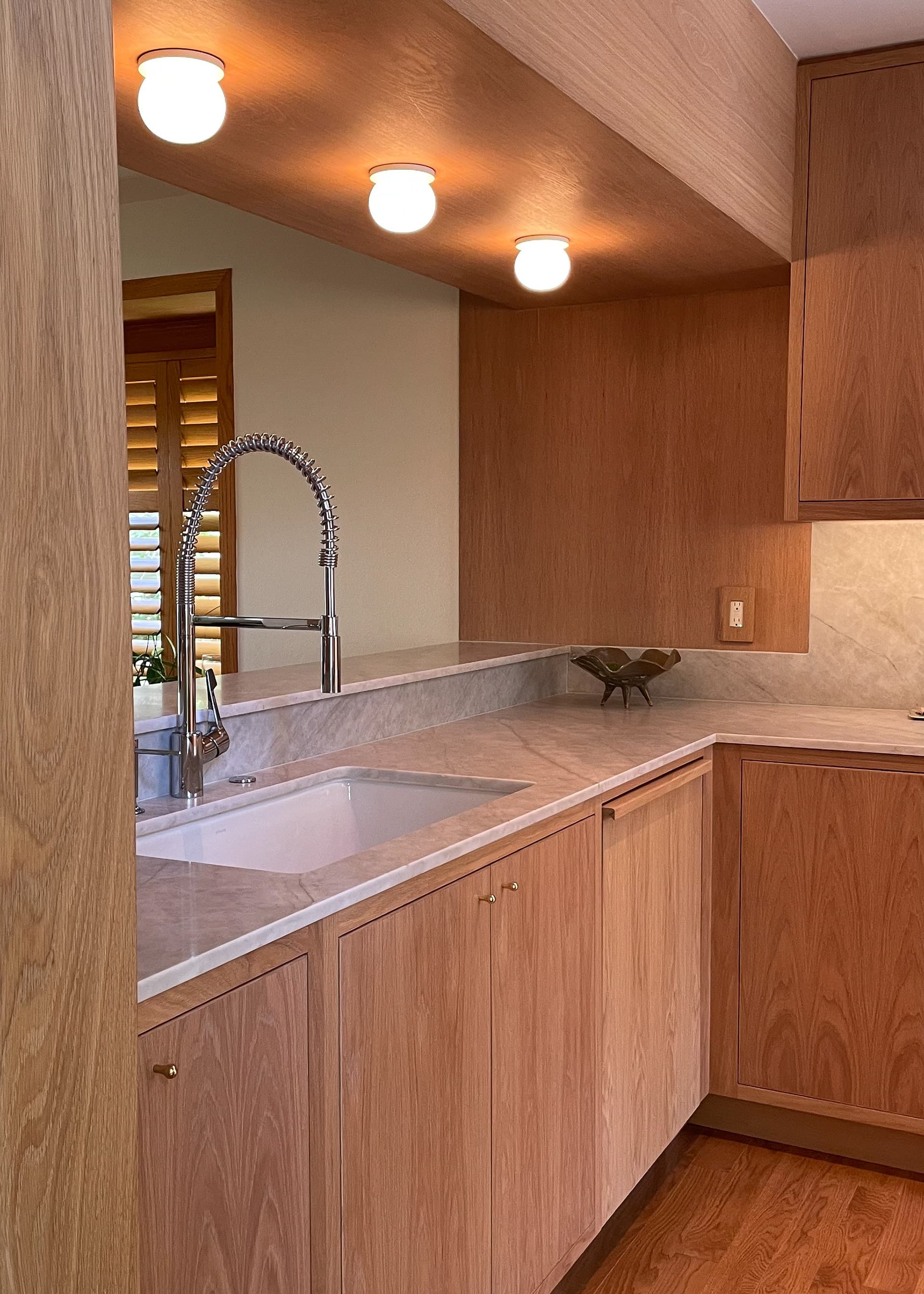 Faircliff: Warm walnut, honed stone, a mid-century calm.
