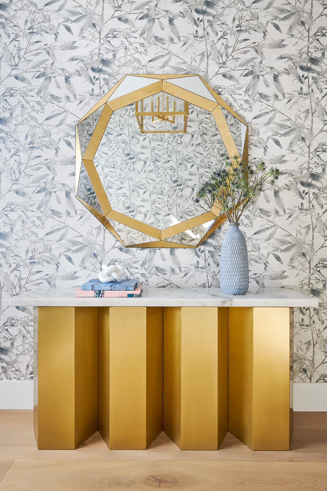 Yorba: A full residence balancing brass, stone, and a calm graphic hand.